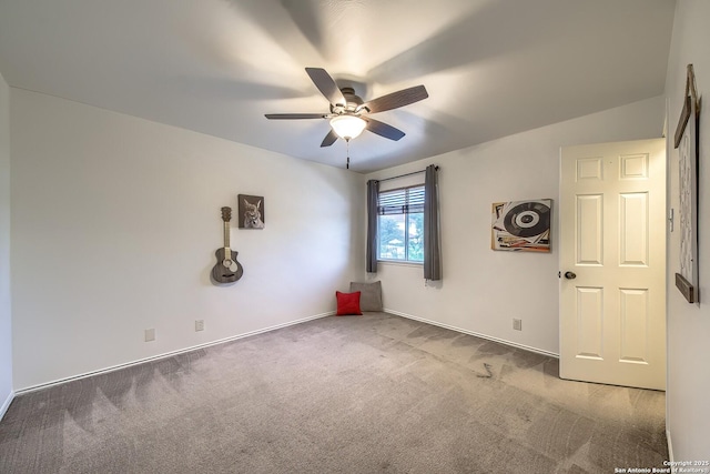 empty room featuring ceiling fan, carpet flooring, and baseboards