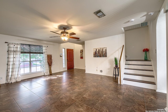 entryway featuring a ceiling fan, stairs, and baseboards