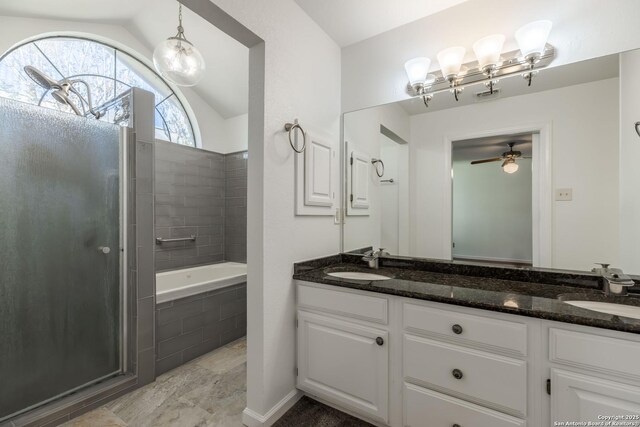 107 Mesa Del Sol, Kerrville, TX 78028 - bathroom featuring a shower, vaulted ceiling, a ceiling fan, tiled bath, and double vanity