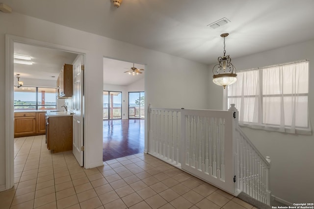 107 Mesa Del Sol, Kerrville, TX 78028 - unfurnished room featuring light tile patterned flooring, ceiling fan, vaulted ceiling, and a sink