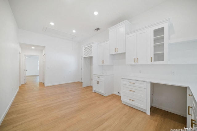 1212 Morales, San Antonio, TX 78207 - kitchen featuring white cabinetry, light wood-style flooring, and recessed lighting
