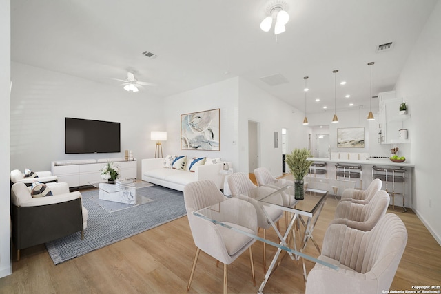 1212 Morales, San Antonio, TX 78207 - living room featuring light wood-type flooring, a ceiling fan, and recessed lighting