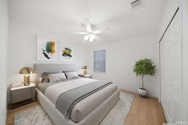 1212 Morales, San Antonio, TX 78207 - bedroom featuring light wood finished floors, a closet, ceiling fan, and baseboards