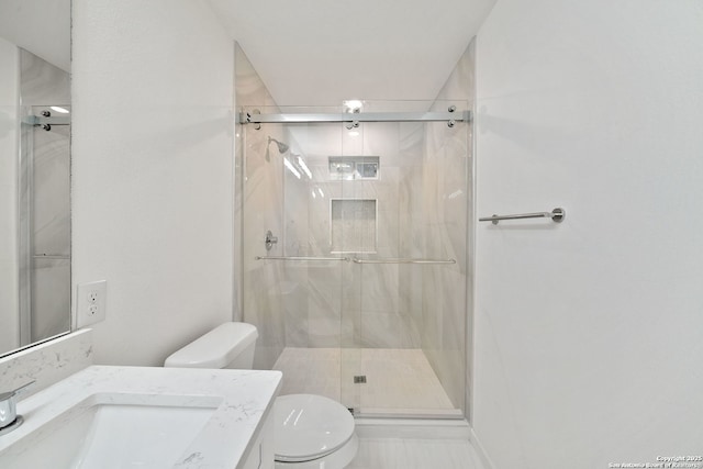 1212 Morales, San Antonio, TX 78207 - bathroom featuring toilet, a marble finish shower, and vanity