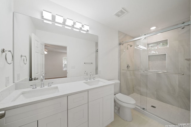 1212 Morales, San Antonio, TX 78207 - full bathroom featuring toilet, a stall shower, and double vanity