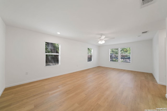 1212 Morales, San Antonio, TX 78207 - spare room with a ceiling fan, light wood-style floors, baseboards, and recessed lighting