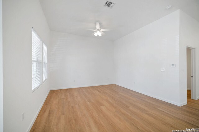 1212 Morales, San Antonio, TX 78207 - spare room with ceiling fan, light wood-style flooring, and baseboards