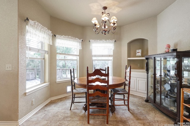 201 Oak Rdg, Boerne, TX 78006 - dining area with a chandelier and a textured wall