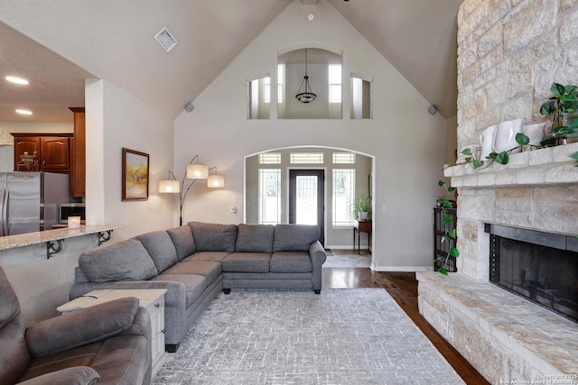 201 Oak Rdg, Boerne, TX 78006 - living room with dark wood-style floors, healthy amount of natural light, and a fireplace