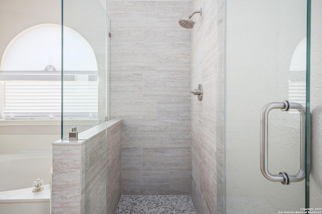 18127 Brookwood Frst, San Antonio, TX 78258 - bathroom featuring a tile shower