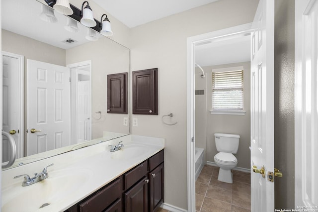 18127 Brookwood Frst, San Antonio, TX 78258 - bathroom with toilet, baseboards, double vanity, and tub / shower combination