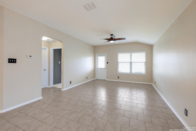 173 Kildeer Crk, San Antonio, TX 78253 - empty room featuring arched walkways, a ceiling fan, vaulted ceiling, baseboards, and light tile patterned floors