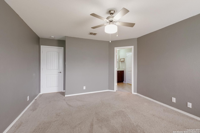 173 Kildeer Crk, San Antonio, TX 78253 - unfurnished bedroom featuring baseboards, light colored carpet, connected bathroom, and ceiling fan