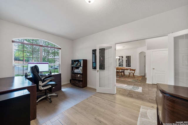 1326 Walkers Way, San Antonio, TX 78216 - office area with light wood-style flooring, arched walkways, and baseboards