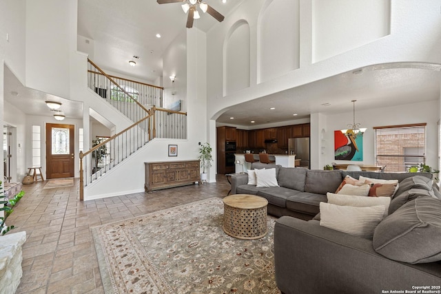 1326 Walkers Way, San Antonio, TX 78216 - living area with a high ceiling, ceiling fan, arched walkways, stone tile flooring, and recessed lighting