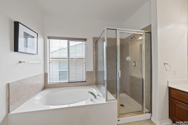 1326 Walkers Way, San Antonio, TX 78216 - bathroom featuring a shower stall, vanity, a garden tub, and a textured wall