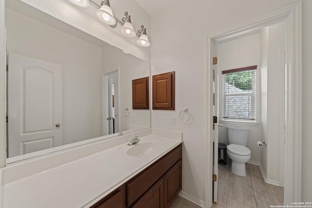1326 Walkers Way, San Antonio, TX 78216 - bathroom with toilet, vanity, and baseboards