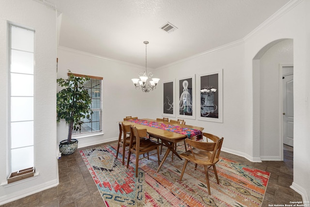 1326 Walkers Way, San Antonio, TX 78216 - dining area with arched walkways, ornamental molding, a chandelier, baseboards, and stone finish flooring