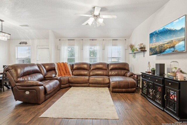 7938 Sterling Mnr, Converse, TX 78109 - living room featuring a ceiling fan, healthy amount of natural light, dark wood-style flooring, and lofted ceiling