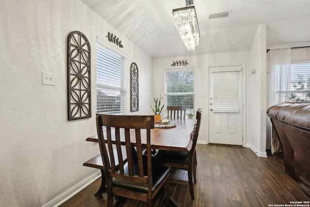 7938 Sterling Mnr, Converse, TX 78109 - dining room with dark wood finished floors, a chandelier, baseboards, and a textured wall
