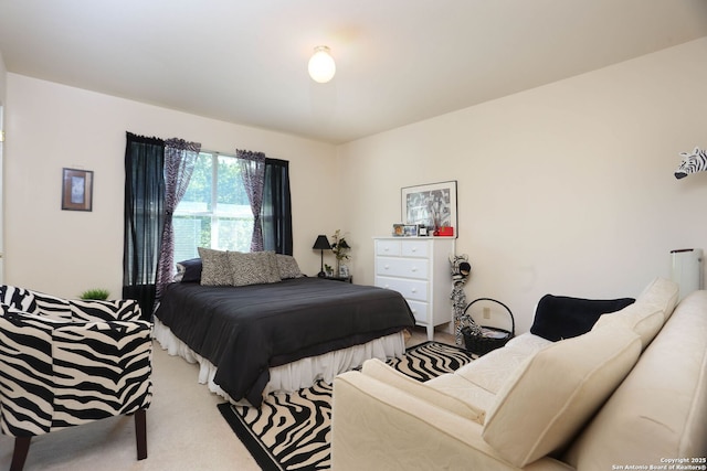 bedroom with light carpet