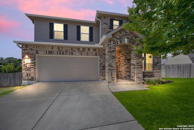11334 Hill Top Bnd, Helotes, TX 78023 - traditional-style home featuring a garage, driveway, and brick siding