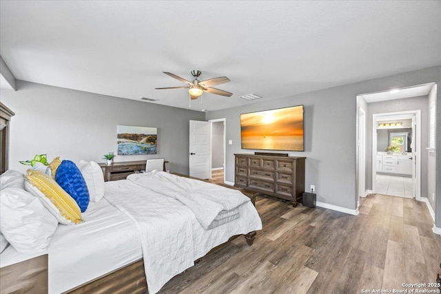 11334 Hill Top Bnd, Helotes, TX 78023 - bedroom with baseboards, wood finished floors, and a ceiling fan