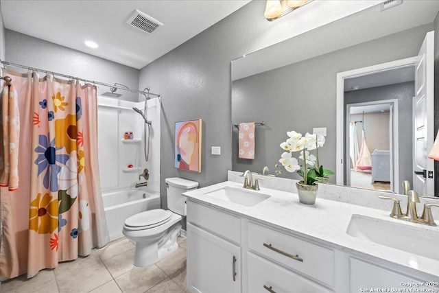 11334 Hill Top Bnd, Helotes, TX 78023 - full bathroom with a textured wall, toilet, tile patterned floors, double vanity, and shower / bath combination with curtain