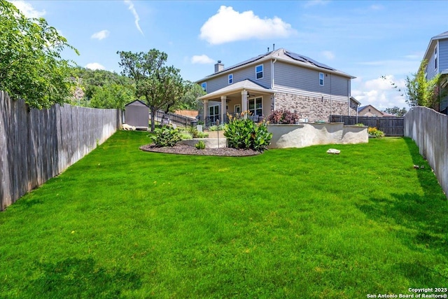 11334 Hill Top Bnd, Helotes, TX 78023 - rear view of property with a storage shed, stone siding, solar panels, an outdoor structure, and a ceiling fan