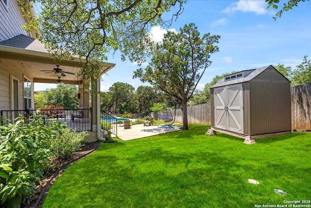 11334 Hill Top Bnd, Helotes, TX 78023 - view of yard with a patio area, a ceiling fan, a storage unit, and an outdoor structure