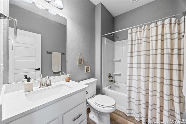 11334 Hill Top Bnd, Helotes, TX 78023 - bathroom featuring wood finished floors, a textured wall, toilet, vanity, and shower / tub combo with curtain