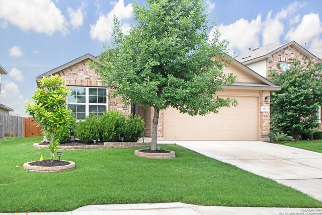 9525 Moon Shine, San Antonio, TX 78254 - view of property hidden behind natural elements with brick siding, concrete driveway, and an attached garage