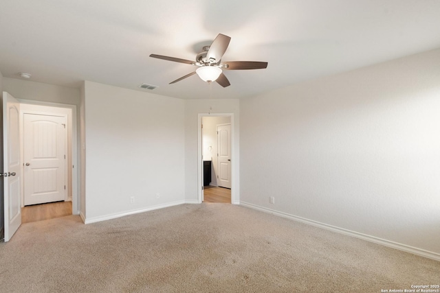 9525 Moon Shine, San Antonio, TX 78254 - unfurnished bedroom with light carpet, baseboards, and ceiling fan