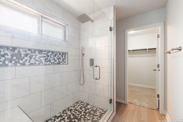 9525 Moon Shine, San Antonio, TX 78254 - full bath with a shower stall, wood finished floors, a walk in closet, and baseboards