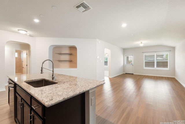 9525 Moon Shine, San Antonio, TX 78254 - kitchen with a sink, arched walkways, open floor plan, recessed lighting, and lofted ceiling