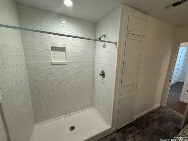 full bathroom featuring a shower stall, baseboards, and recessed lighting