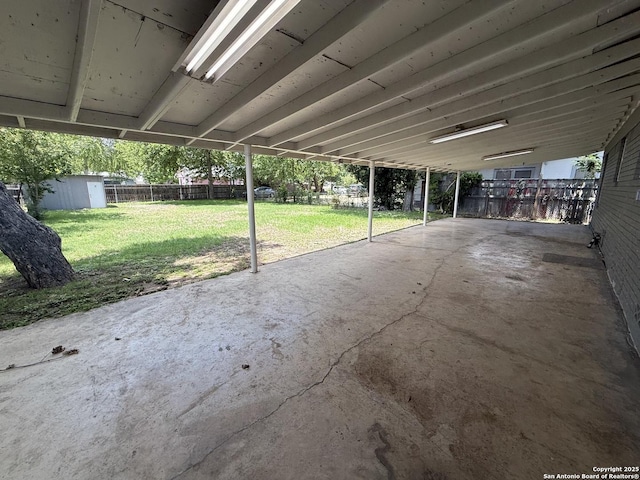 view of patio / terrace featuring a storage shed and an outdoor structure