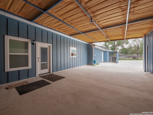 182 Inwood, Poteet, TX 78065 - property entrance with board and batten siding and a patio