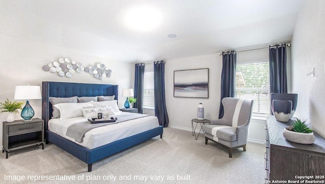 carpeted bedroom with baseboards