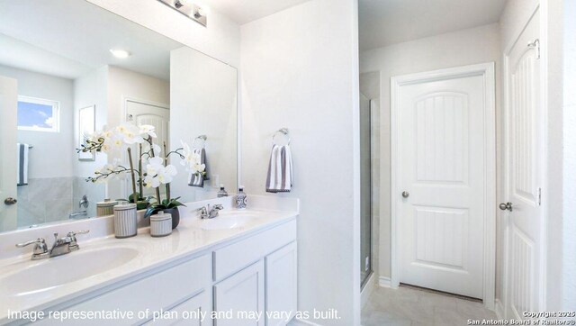 full bath with double vanity and a shower with door