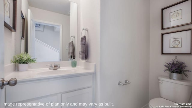 bathroom with vanity and toilet