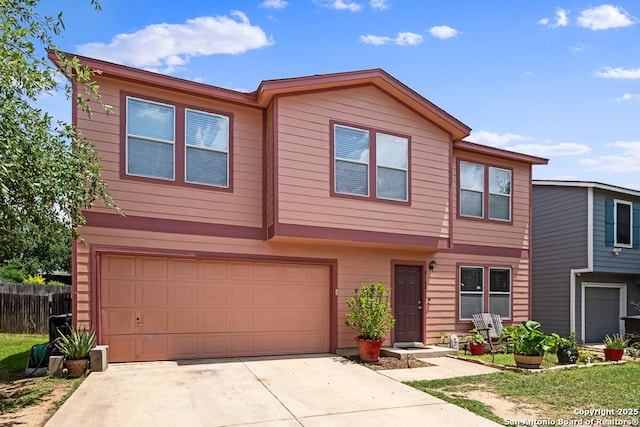 9127 Sycamore, San Antonio, TX 78245 - multi unit property featuring an attached garage, concrete driveway, and fence