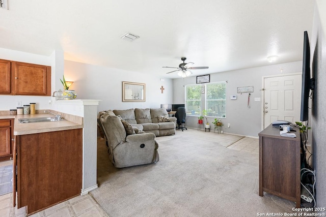 9127 Sycamore, San Antonio, TX 78245 - living room featuring ceiling fan, light colored carpet, baseboards, and an office area