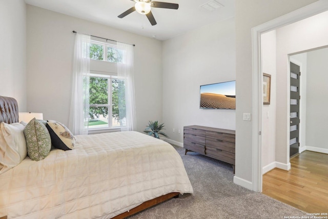 bedroom with baseboards, ceiling fan, and carpet floors