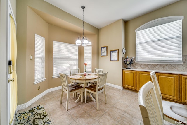 438 Chimney Tops, San Antonio, TX 78260 - dining room featuring a chandelier, light tile patterned floors, and baseboards
