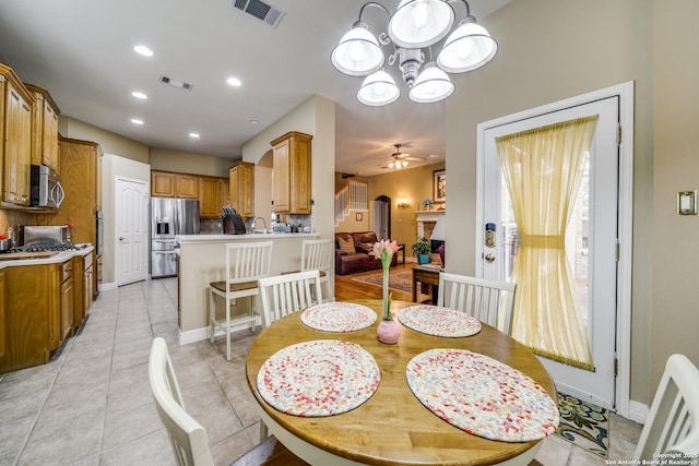 438 Chimney Tops, San Antonio, TX 78260 - dining space featuring a chandelier, a ceiling fan, light tile patterned floors, baseboards, and recessed lighting