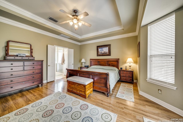 438 Chimney Tops, San Antonio, TX 78260 - bedroom with a tray ceiling, light wood-style flooring, baseboards, ornamental molding, and connected bathroom