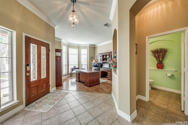 438 Chimney Tops, San Antonio, TX 78260 - foyer with light tile patterned flooring, crown molding, arched walkways, a chandelier, and baseboards
