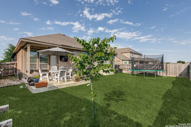 13926 Cohan Way, San Antonio, TX 78253 - rear view of house with a trampoline, a patio area, and a shingled roof