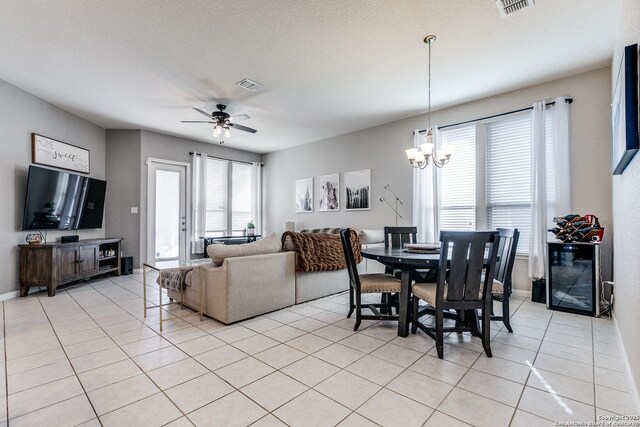 13926 Cohan Way, San Antonio, TX 78253 - dining room featuring a chandelier, light tile patterned floors, and a ceiling fan